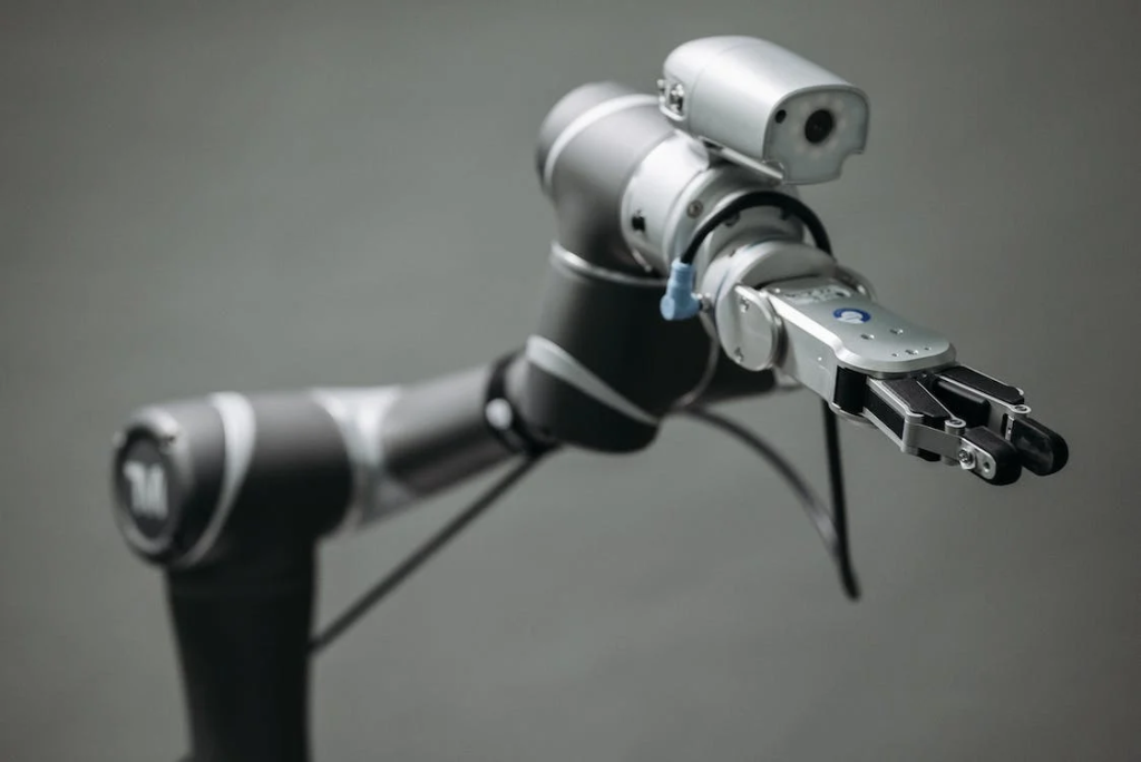 Robotic arm with a vision sensor mounted on top